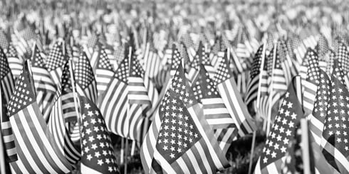 Black and white photo of a field of American flags representing our fallen heroes.