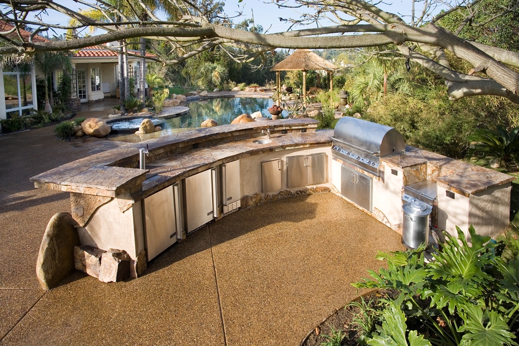 The outdoor kitchen provides plenty of space for hosting large parties.