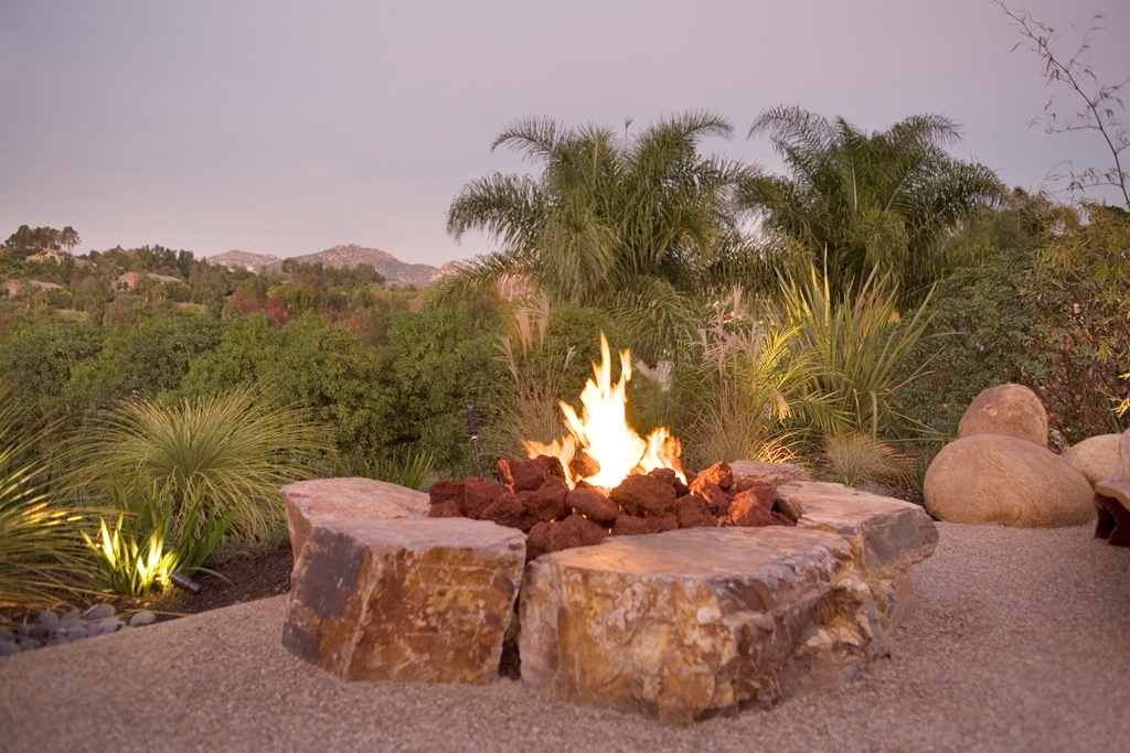 Fire does not need formal containment. A simple rock outcropping provides plenty of room to sit or elevate your feet at the warmth of the flame