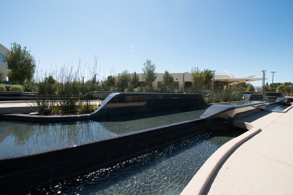 The Intuit campus rain garden included a series of custom solid granite benches machined by Coldspring's multi-axis CNCs. The intent was to create a series of meeting places between the buildings where employees could collaborate with the pleasant sound of falling water around them.